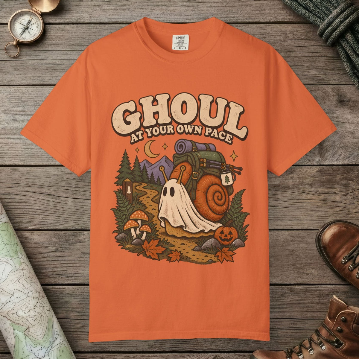 Burnt Orange color unisex graphic t-shirt with "Ghoul At Own Pace" design