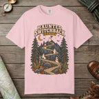 Blossom color unisex graphic t-shirt with "Haunted Switchback Society" design