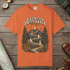 Burnt Orange color unisex graphic t-shirt with "Haunted Switchback Society" design