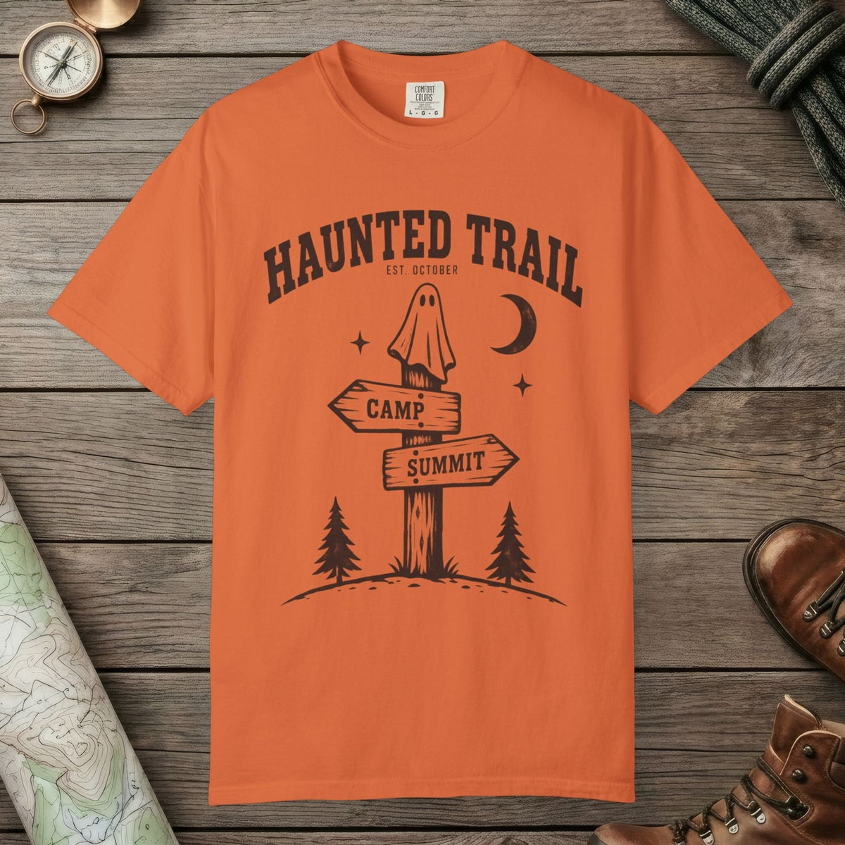Burnt Orange color unisex graphic t-shirt with "Haunted Trail" design