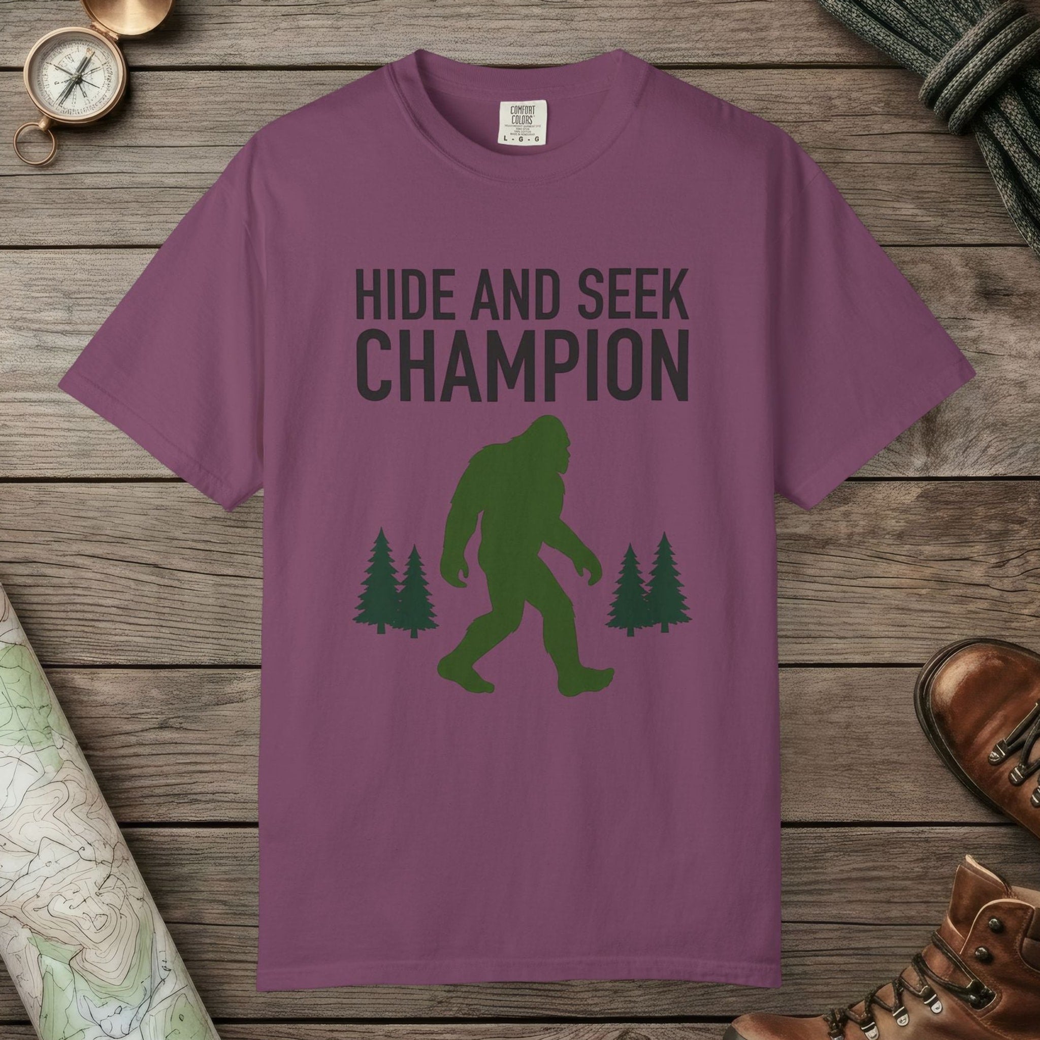 Berry color unisex graphic t-shirt with "Hide And Seek Champion" design