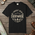 Black color unisex graphic t-shirt with "I Haven't Been to Everywhere" design