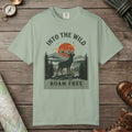 Bay color unisex graphic t-shirt with "Into The Wild Vintage" design