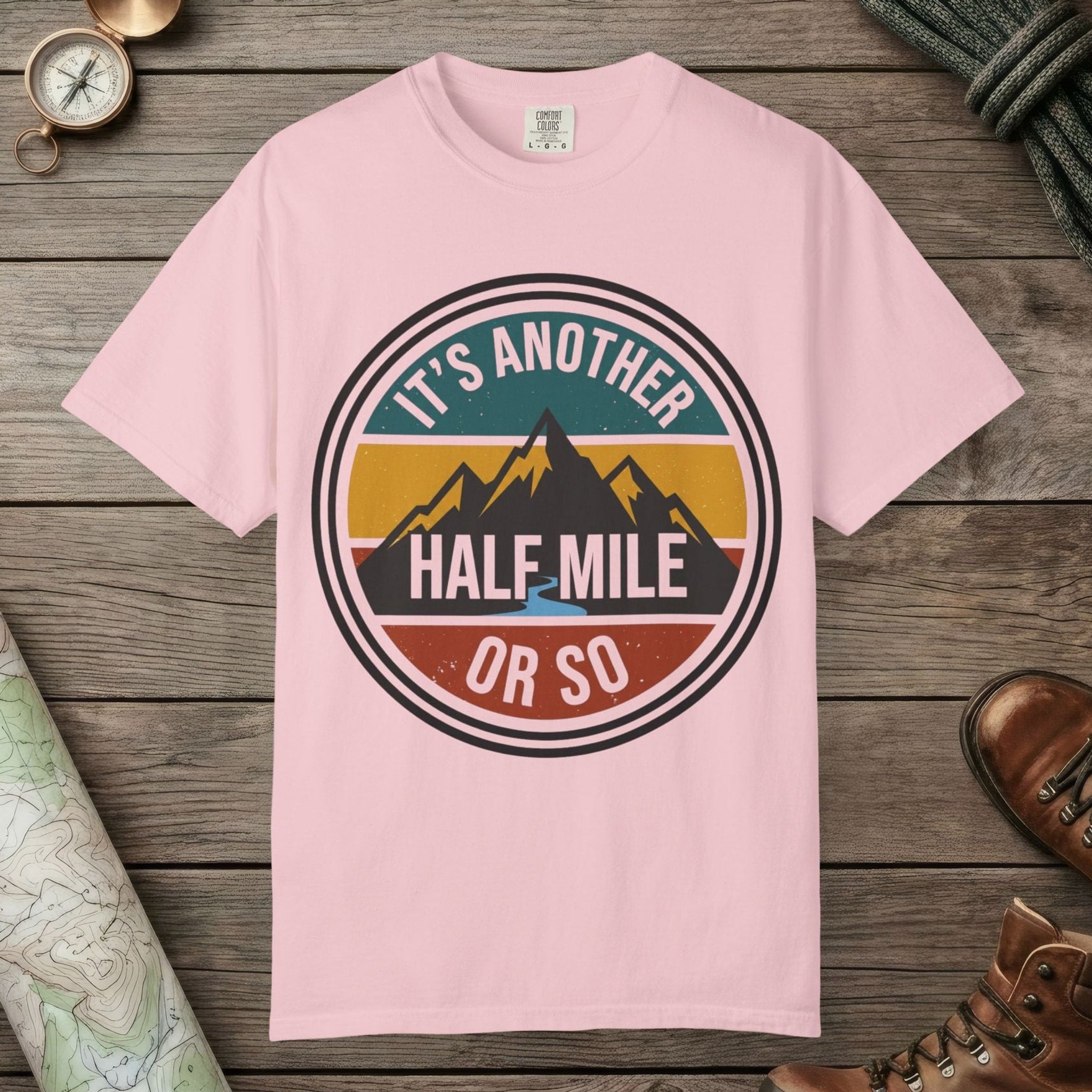 Blossom color unisex graphic t-shirt with "It's Another Half Mile" design