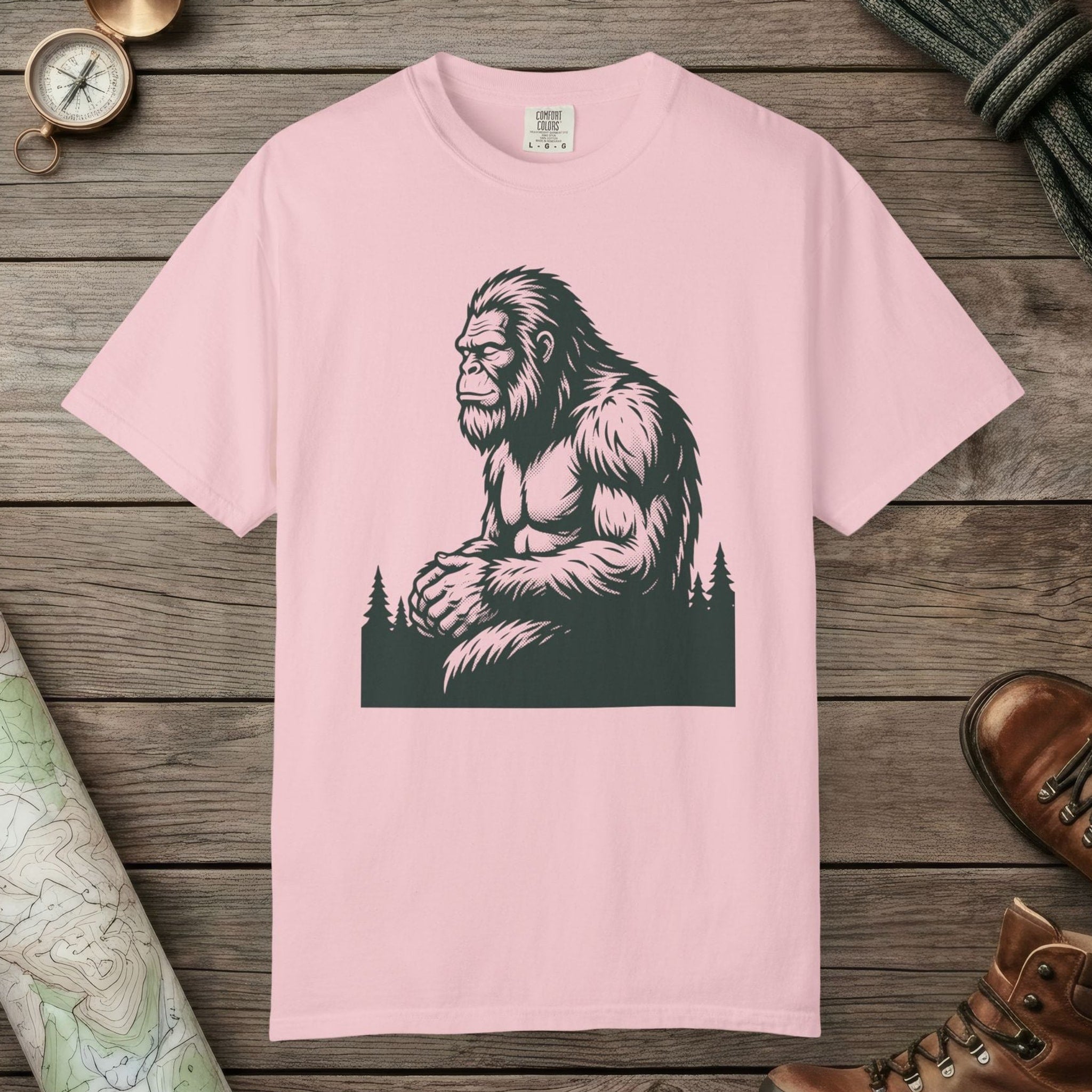 Blossom color unisex graphic t-shirt with "Meditating Bigfoot" design