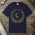 True Navy color unisex graphic t-shirt with "Moon & Wildflower Wreath" design