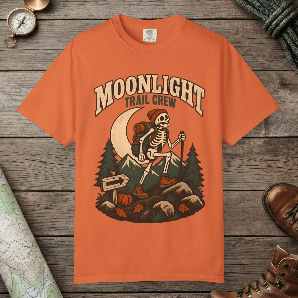 Burnt Orange color unisex graphic t-shirt with "Moonlight Trail Crew" design