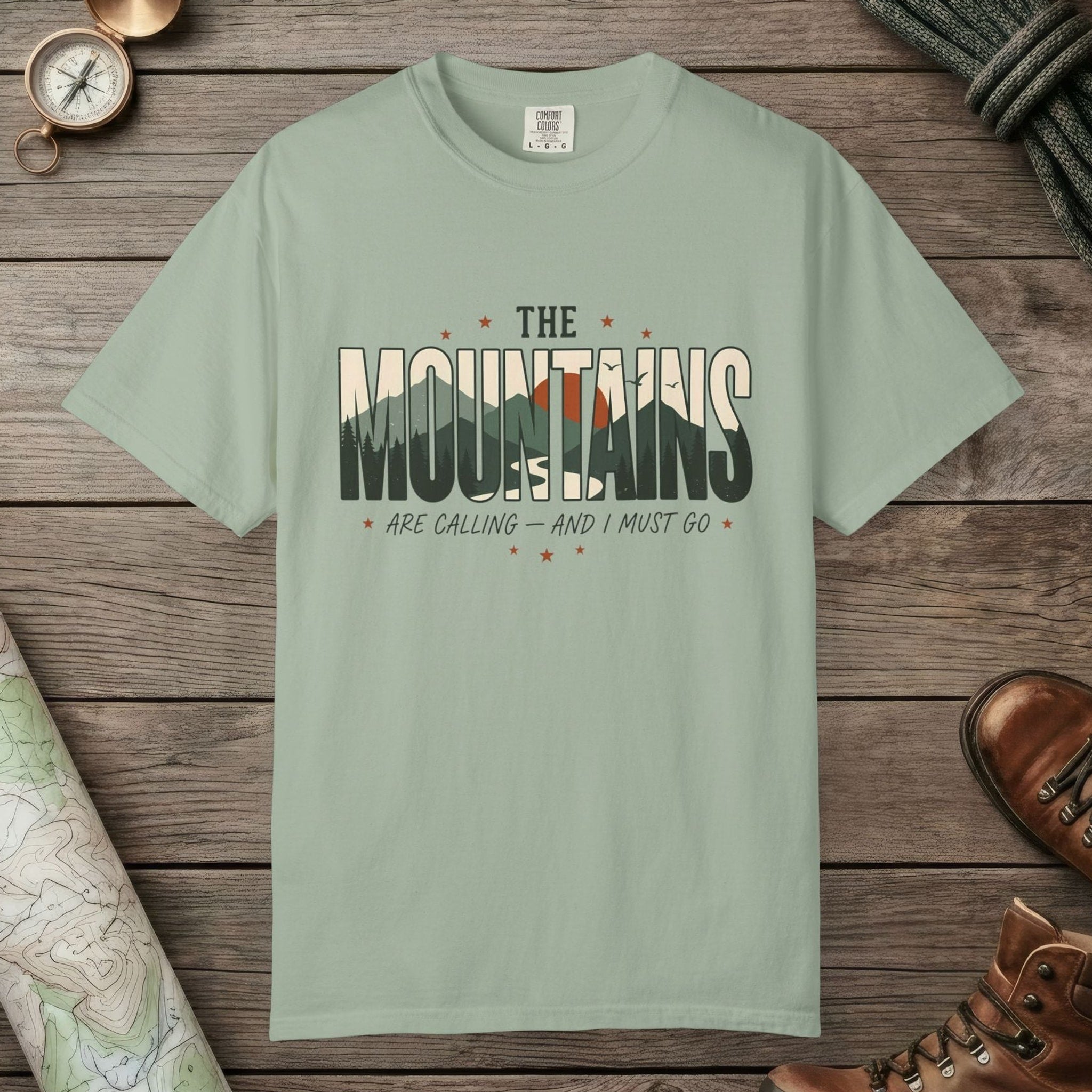 Bay color unisex graphic t-shirt with "Mountains Are Calling" design