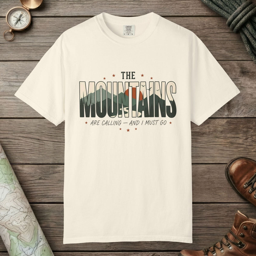 Ivory color unisex graphic t-shirt with "Mountains Are Calling" design