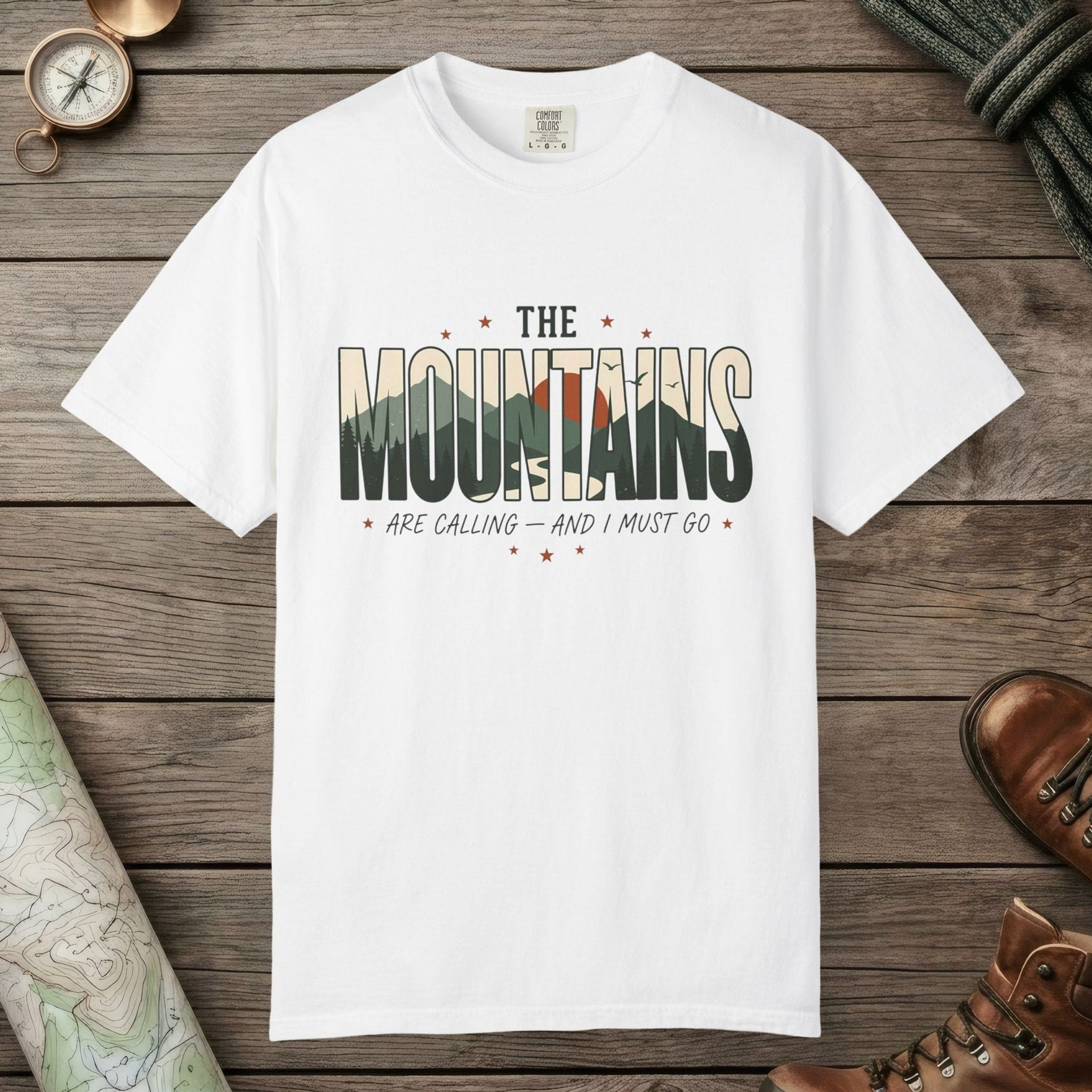 White color unisex graphic t-shirt with "Mountains Are Calling" design