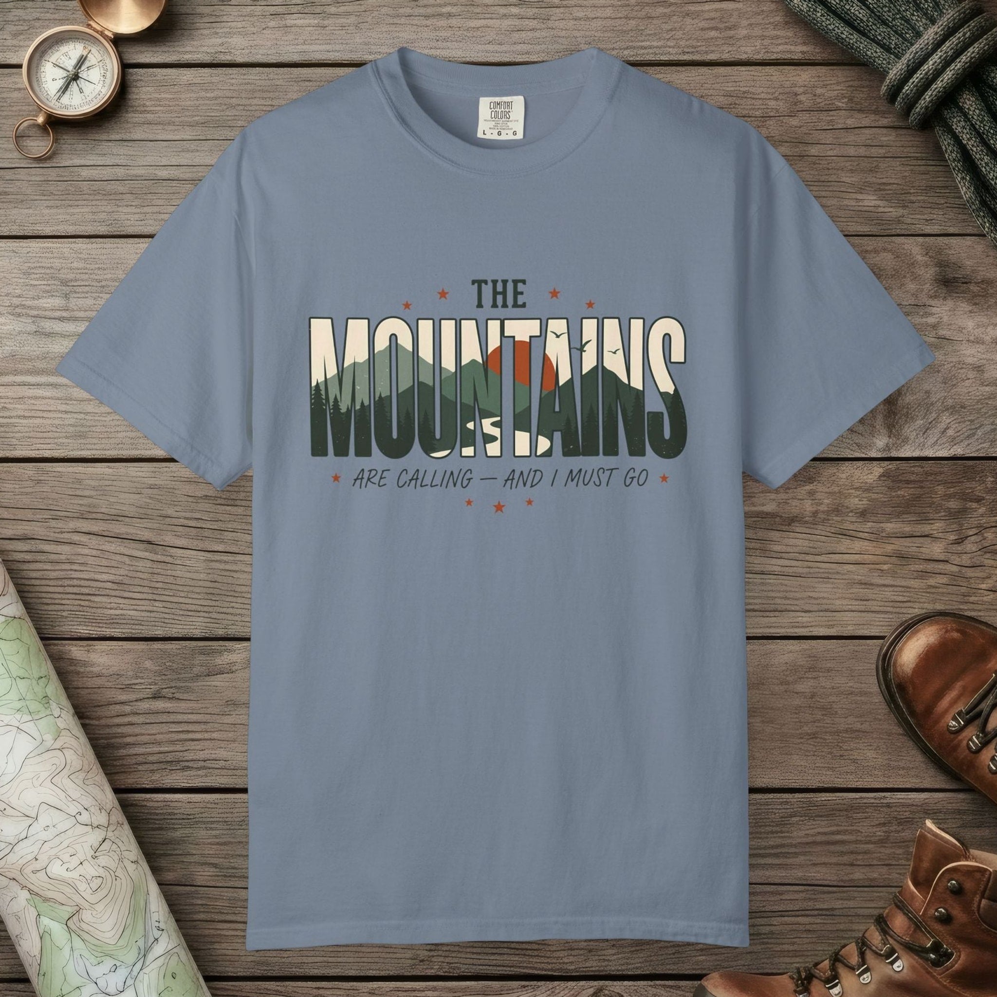 Blue Jean color unisex graphic t-shirt with "Mountains Are Calling" design