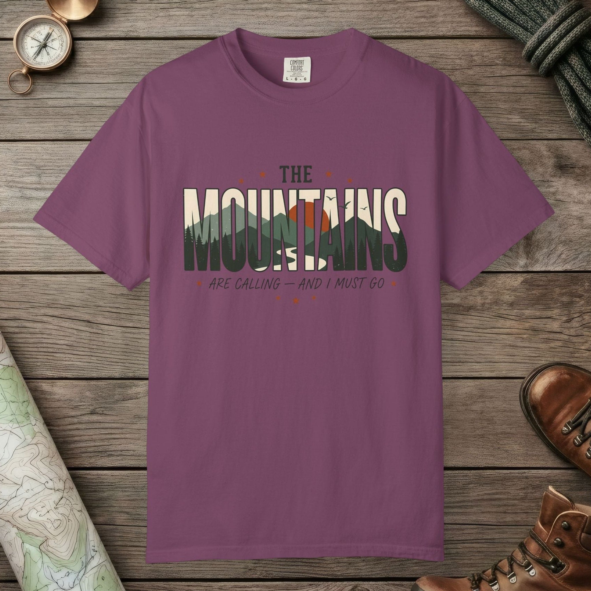 Berry color unisex graphic t-shirt with "Mountains Are Calling" design