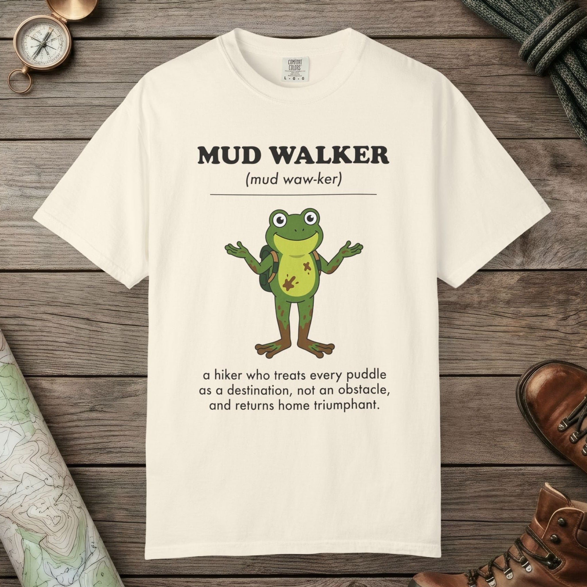 Ivory color unisex graphic t-shirt with "Mud Walker Definition" design