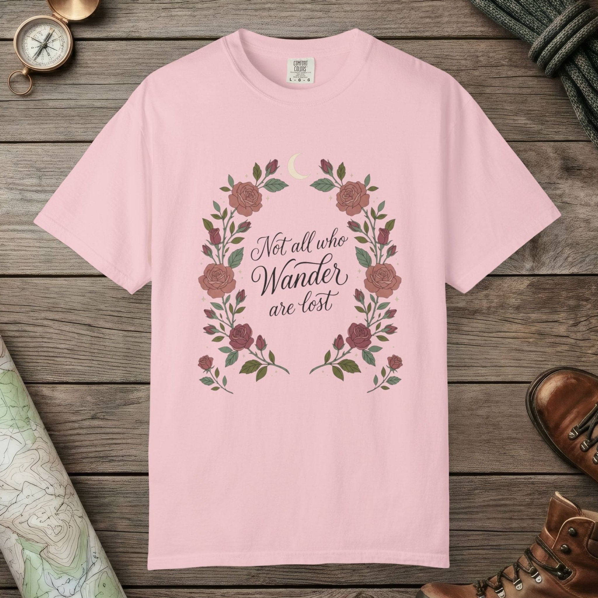 Blossom color unisex graphic t-shirt with "Not All Who Wanders" design