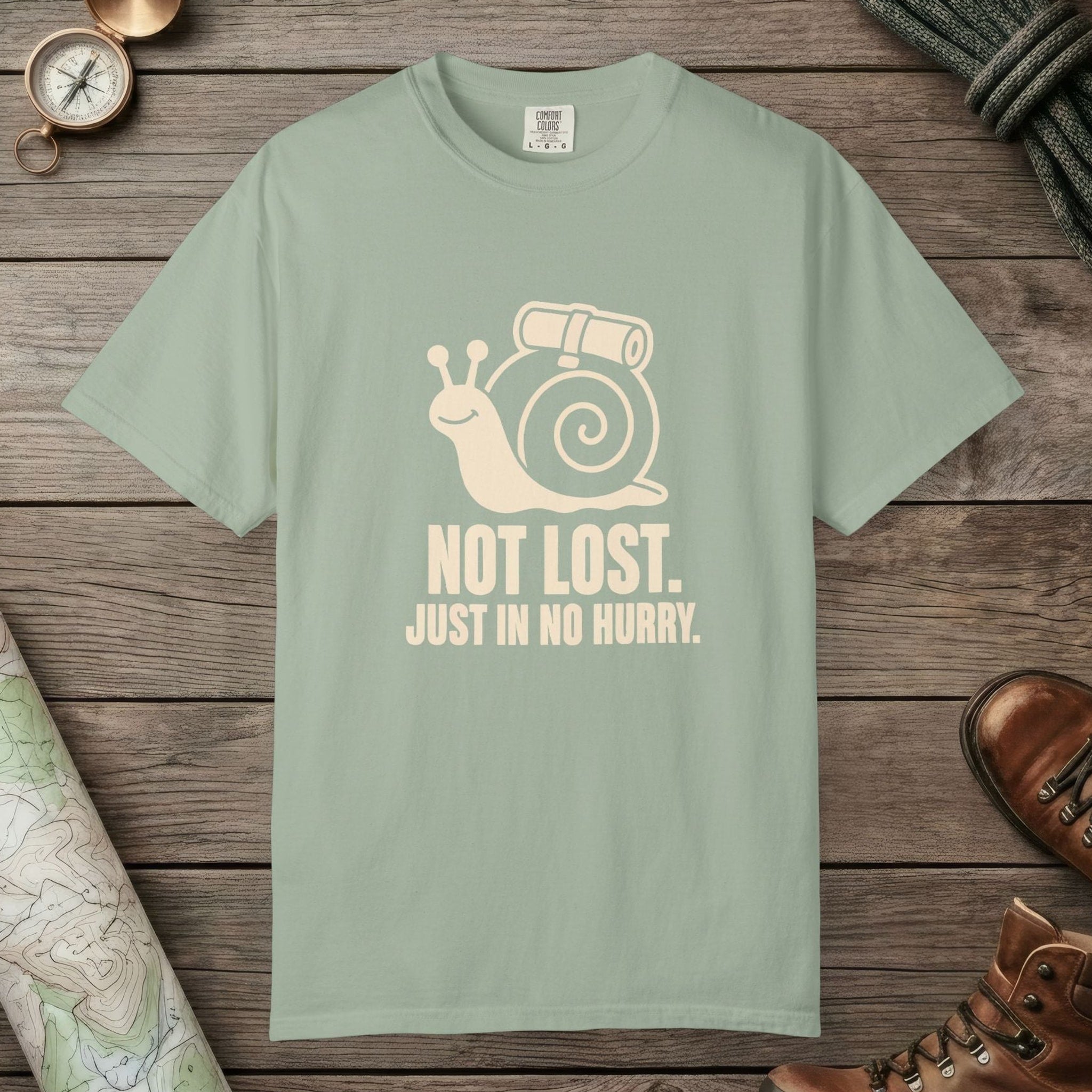 Bay color unisex graphic t-shirt with "Not Lost Snail" design