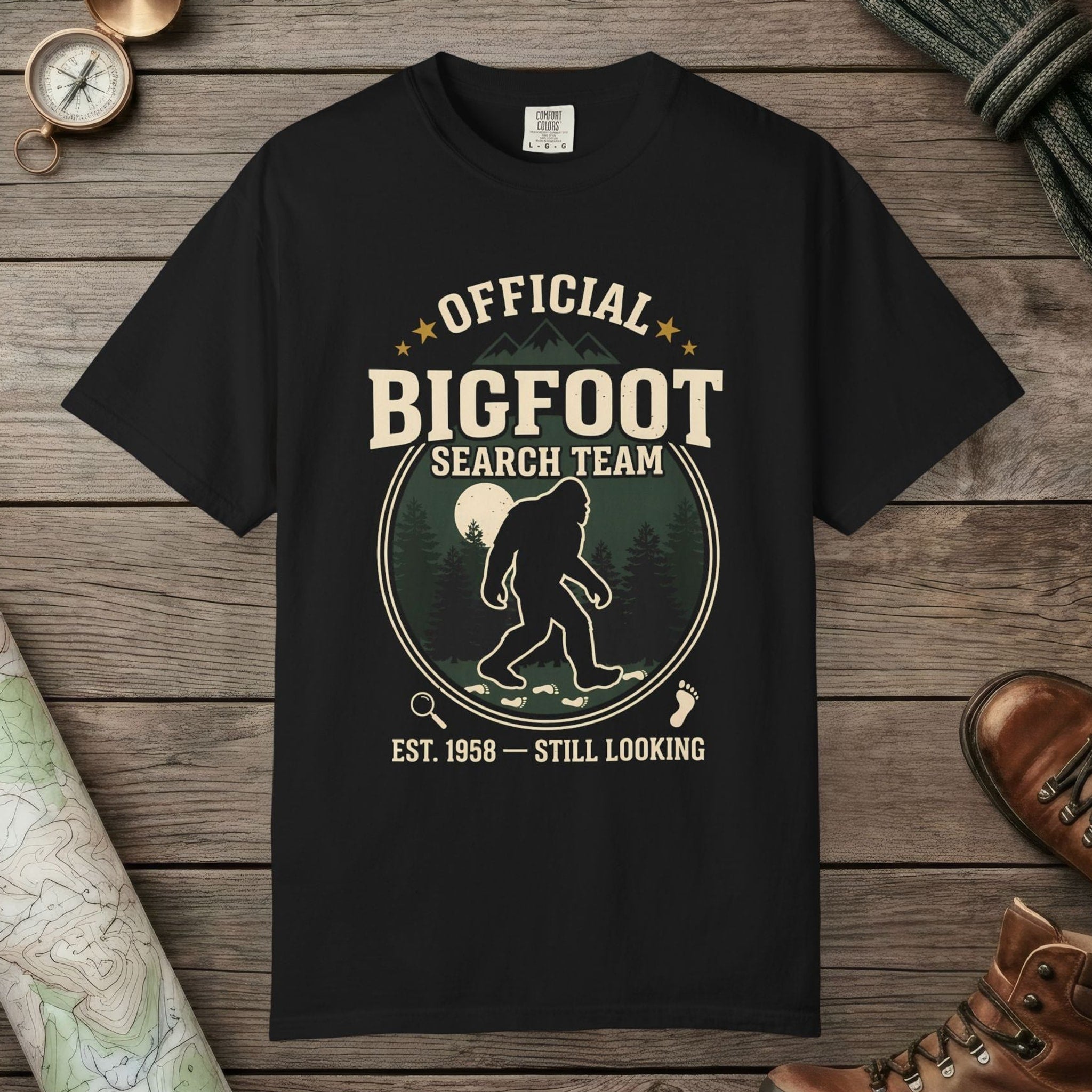 Black color unisex graphic t-shirt with "Official Bigfoot Search Team" design
