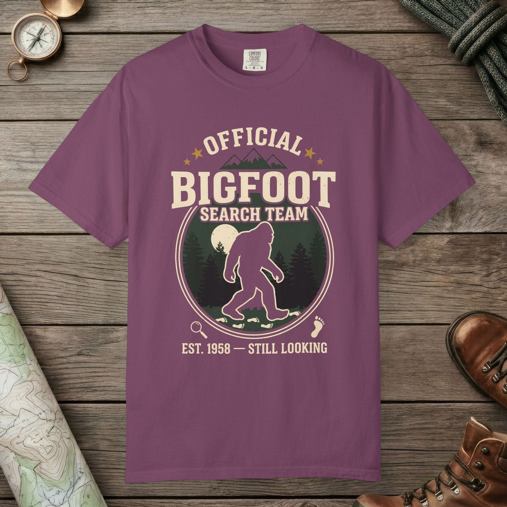 Berry color unisex graphic t-shirt with "Official Bigfoot Search Team" design