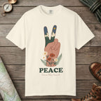 Ivory color unisex graphic t-shirt with "Peace Love The Land" design