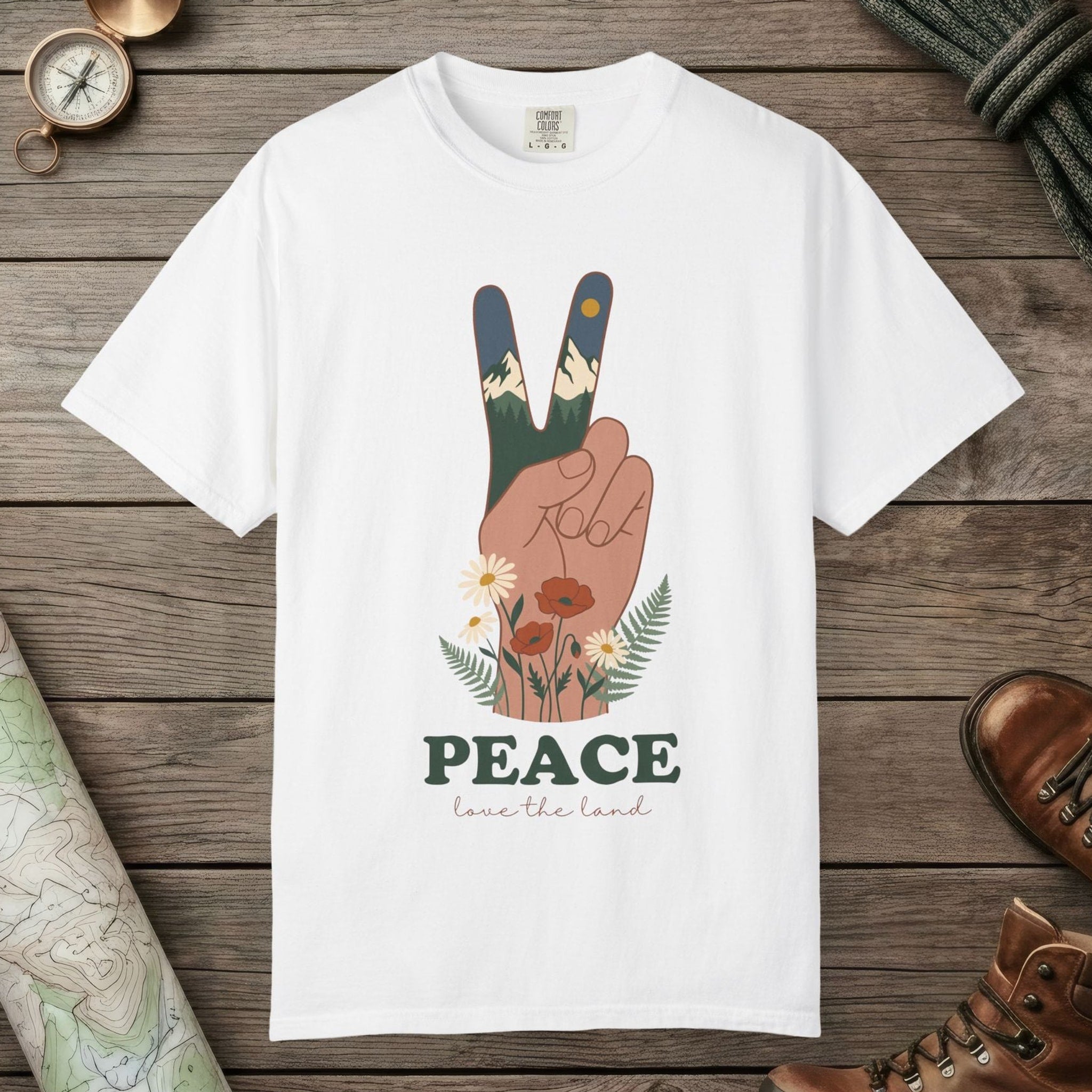White color unisex graphic t-shirt with "Peace Love The Land" design