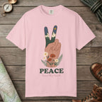 Blossom color unisex graphic t-shirt with "Peace Love The Land" design