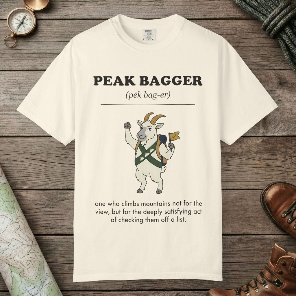 Ivory color unisex graphic t-shirt with "Peak Bagger Definition" design