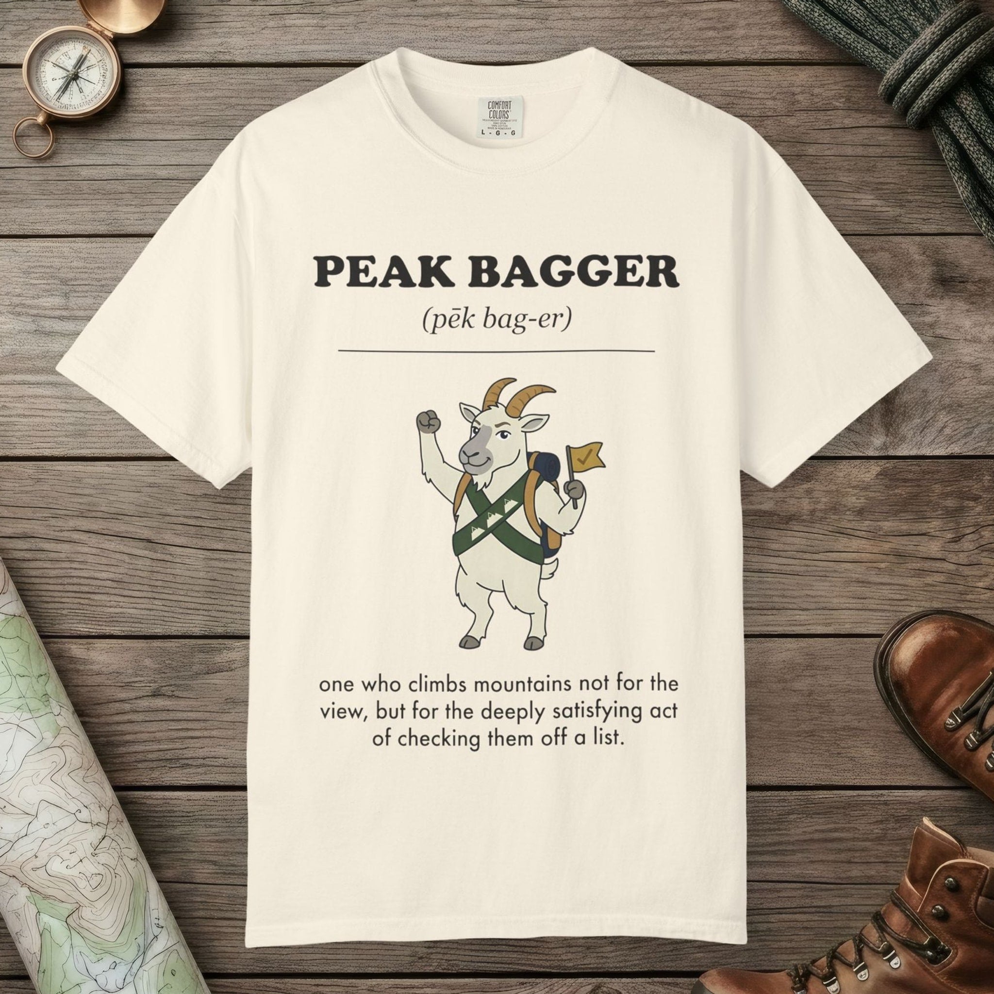 Ivory color unisex graphic t-shirt with "Peak Bagger Definition" design