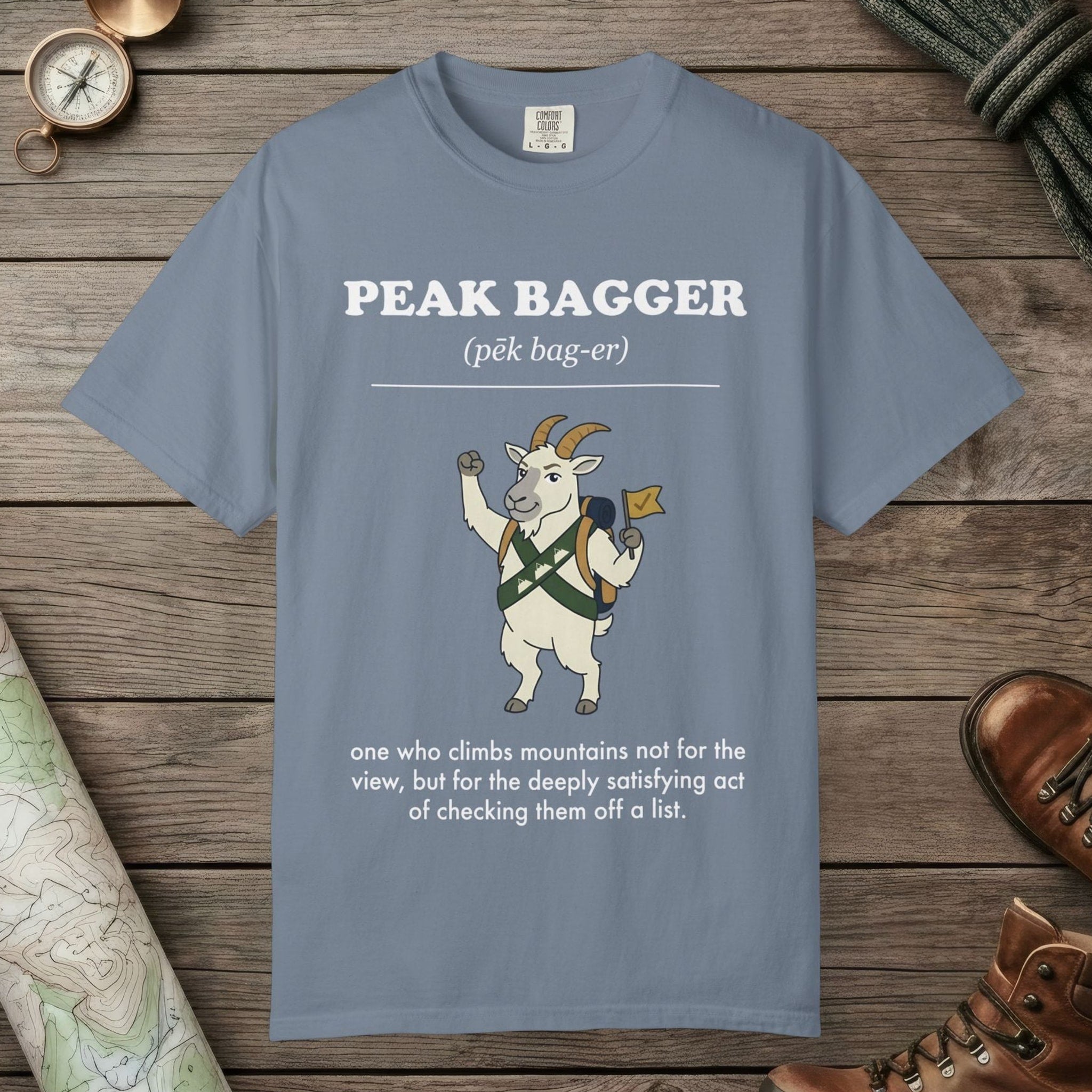 Blue Jean color unisex graphic t-shirt with "Peak Bagger Definition" design