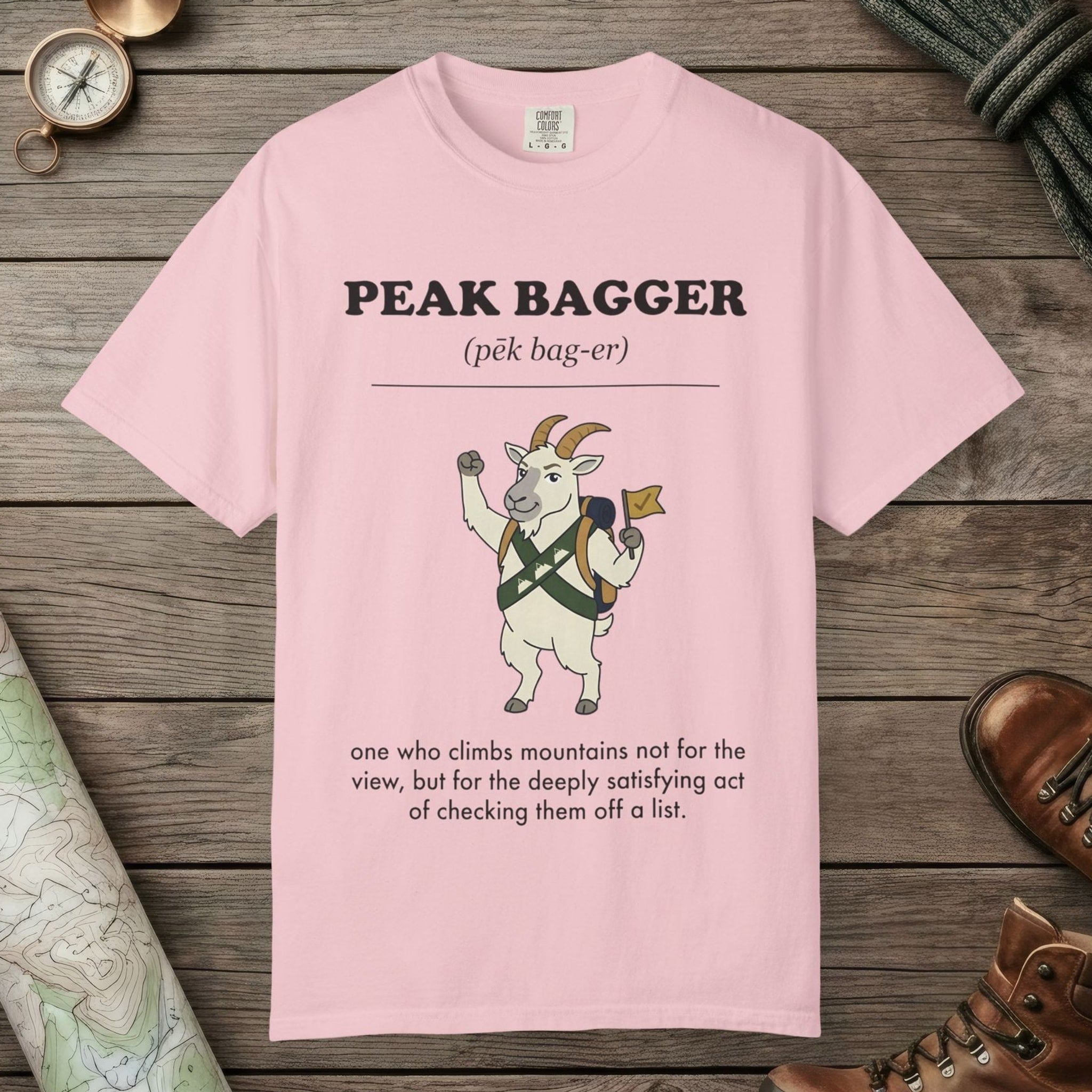 Blossom color unisex graphic t-shirt with "Peak Bagger Definition" design