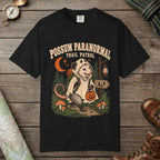 Black color unisex graphic t-shirt with "Possum Paranormal" design