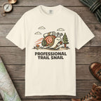 Ivory color unisex graphic t-shirt with "Professional Trail Snail" design