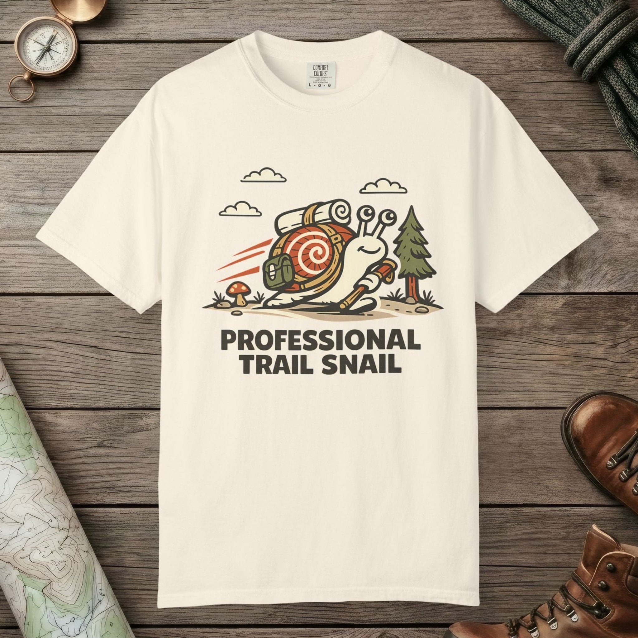 Ivory color unisex graphic t-shirt with "Professional Trail Snail" design