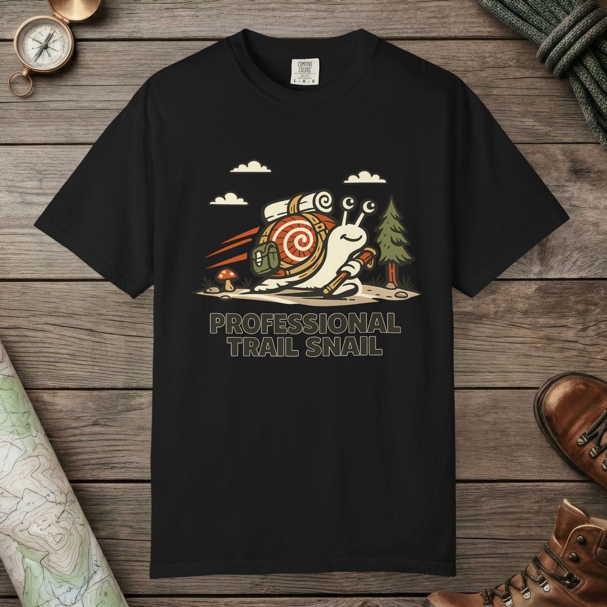Black color unisex graphic t-shirt with "Professional Trail Snail" design