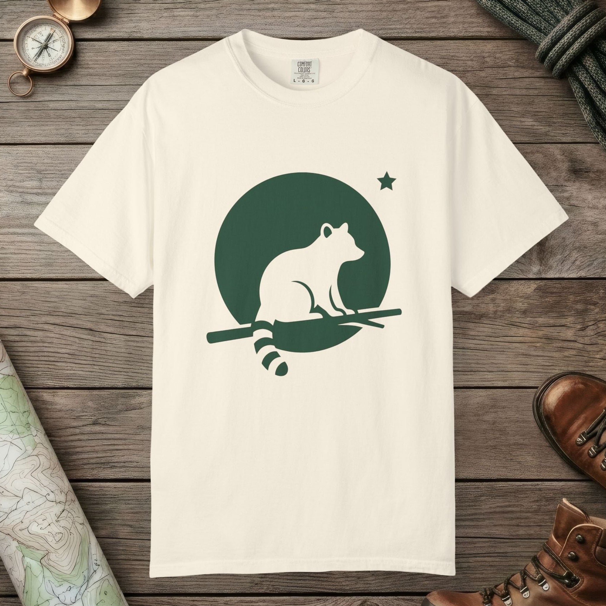 Ivory color unisex graphic t-shirt with "Raccoon Moon Silhouette" design