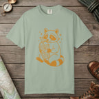 Bay color unisex graphic t-shirt with "Raccoon with Iced Drink" design