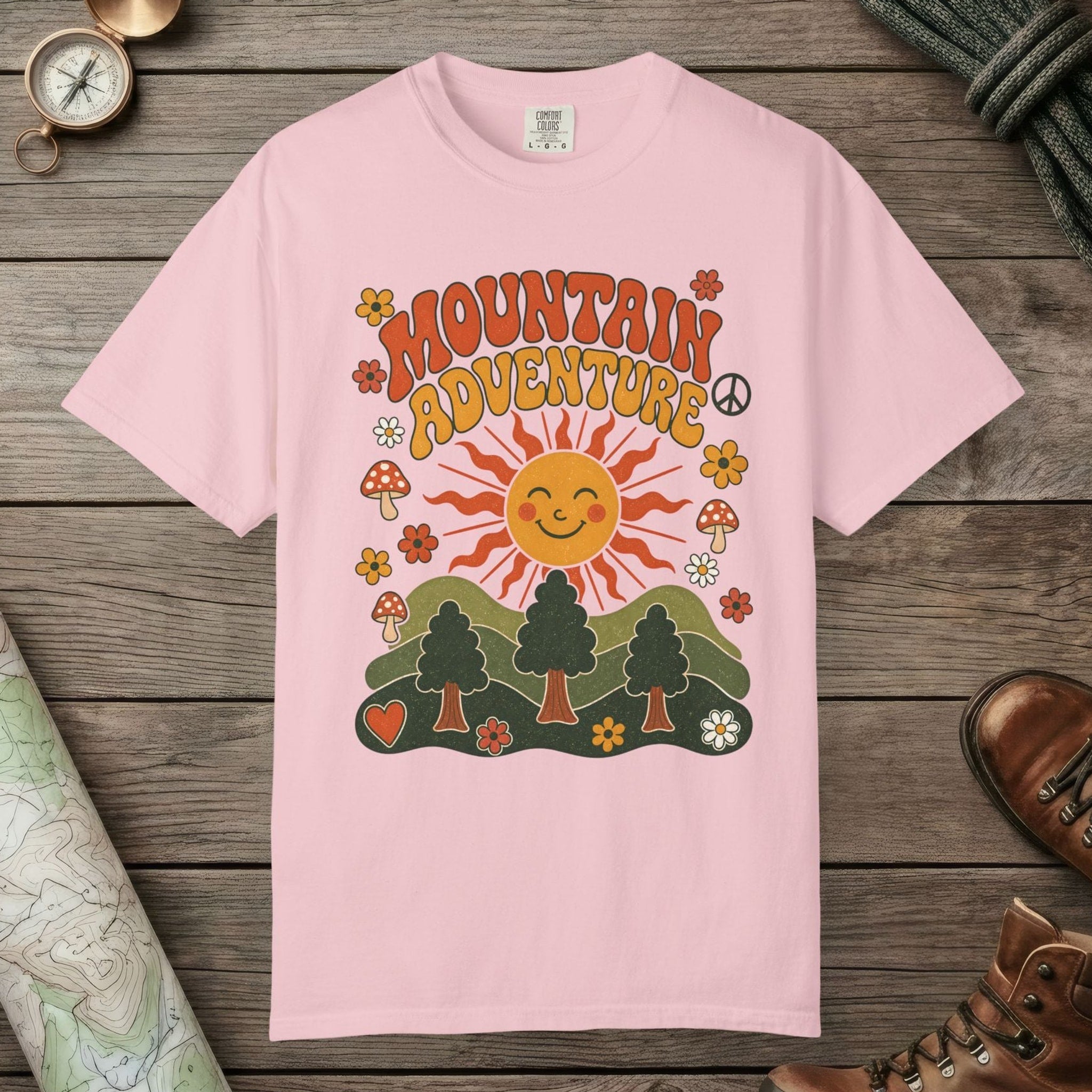 Blossom color unisex graphic t-shirt with "Retro Groovy Mountain Adventure" design