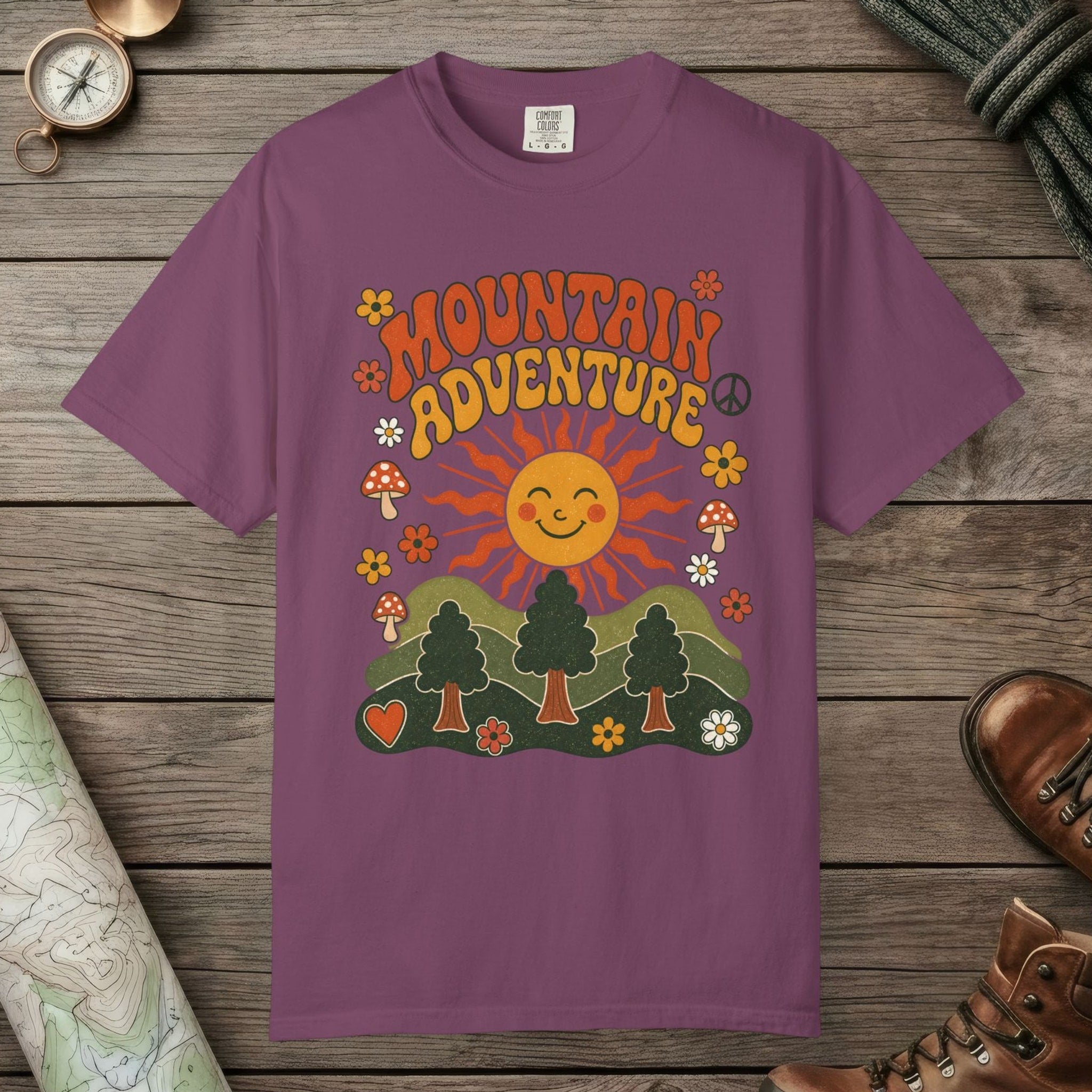 Berry color unisex graphic t-shirt with "Retro Groovy Mountain Adventure" design