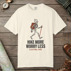 Ivory color unisex graphic t-shirt with "Skeleton Hiking" design