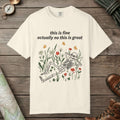 Ivory color unisex graphic t-shirt with "Skeleton in Wildflower Field" design