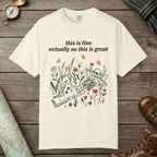 Ivory color unisex graphic t-shirt with "Skeleton in Wildflower Field" design