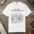 White color unisex graphic t-shirt with "Skeleton in Wildflower Field" design