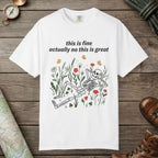 White color unisex graphic t-shirt with "Skeleton in Wildflower Field" design