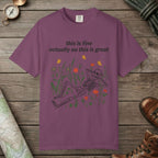 Berry color unisex graphic t-shirt with "Skeleton in Wildflower Field" design