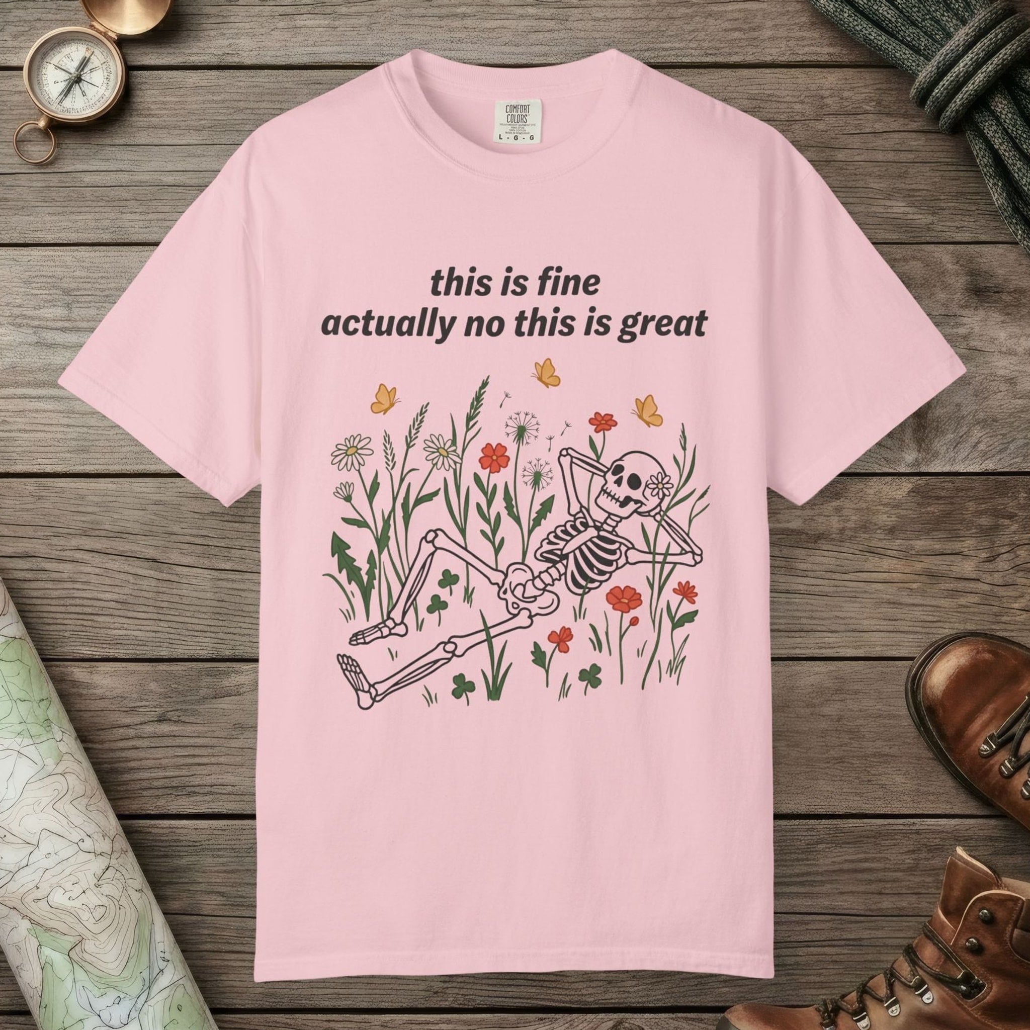 Blossom color unisex graphic t-shirt with "Skeleton in Wildflower Field" design