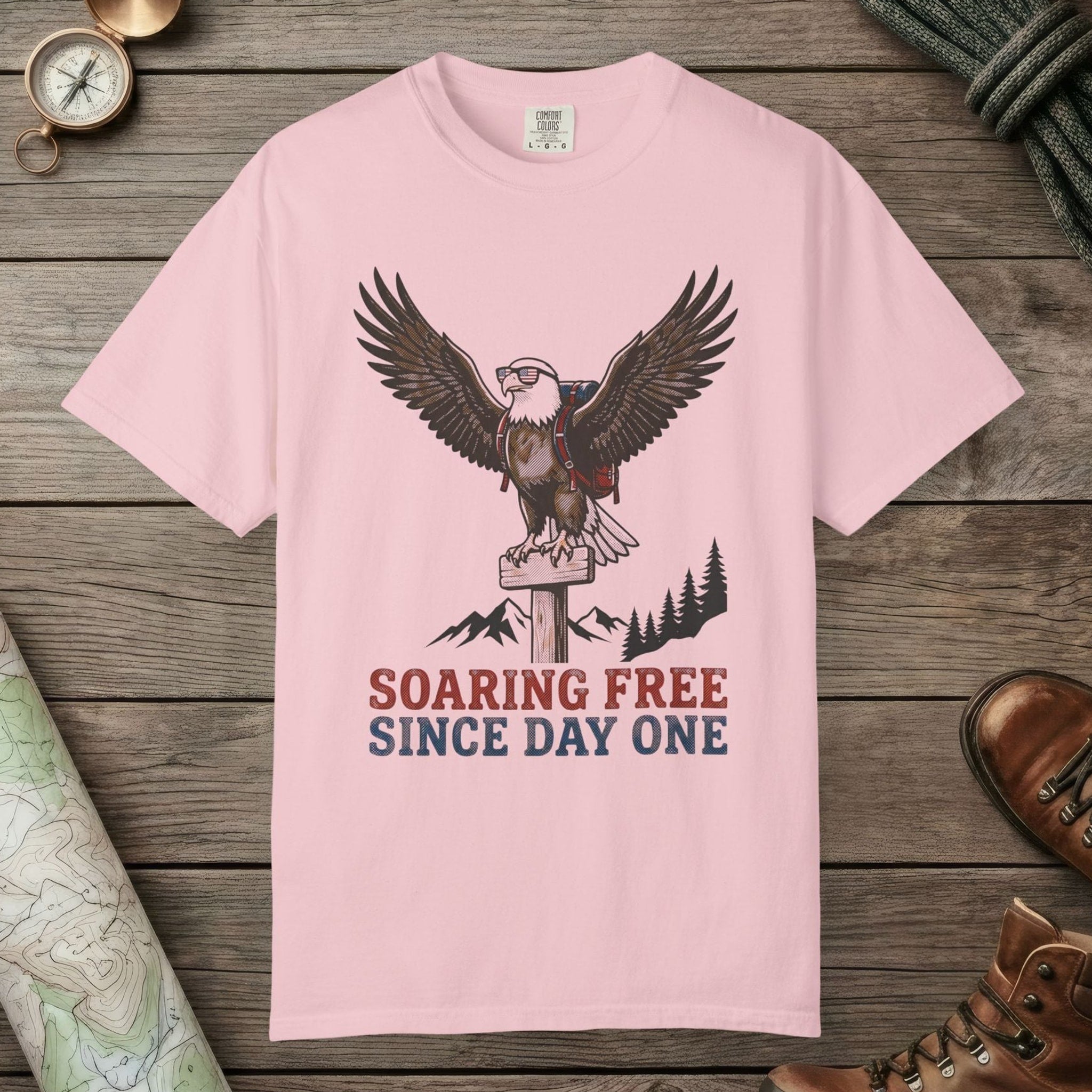 Blossom color unisex graphic t-shirt with "Soaring Free" design