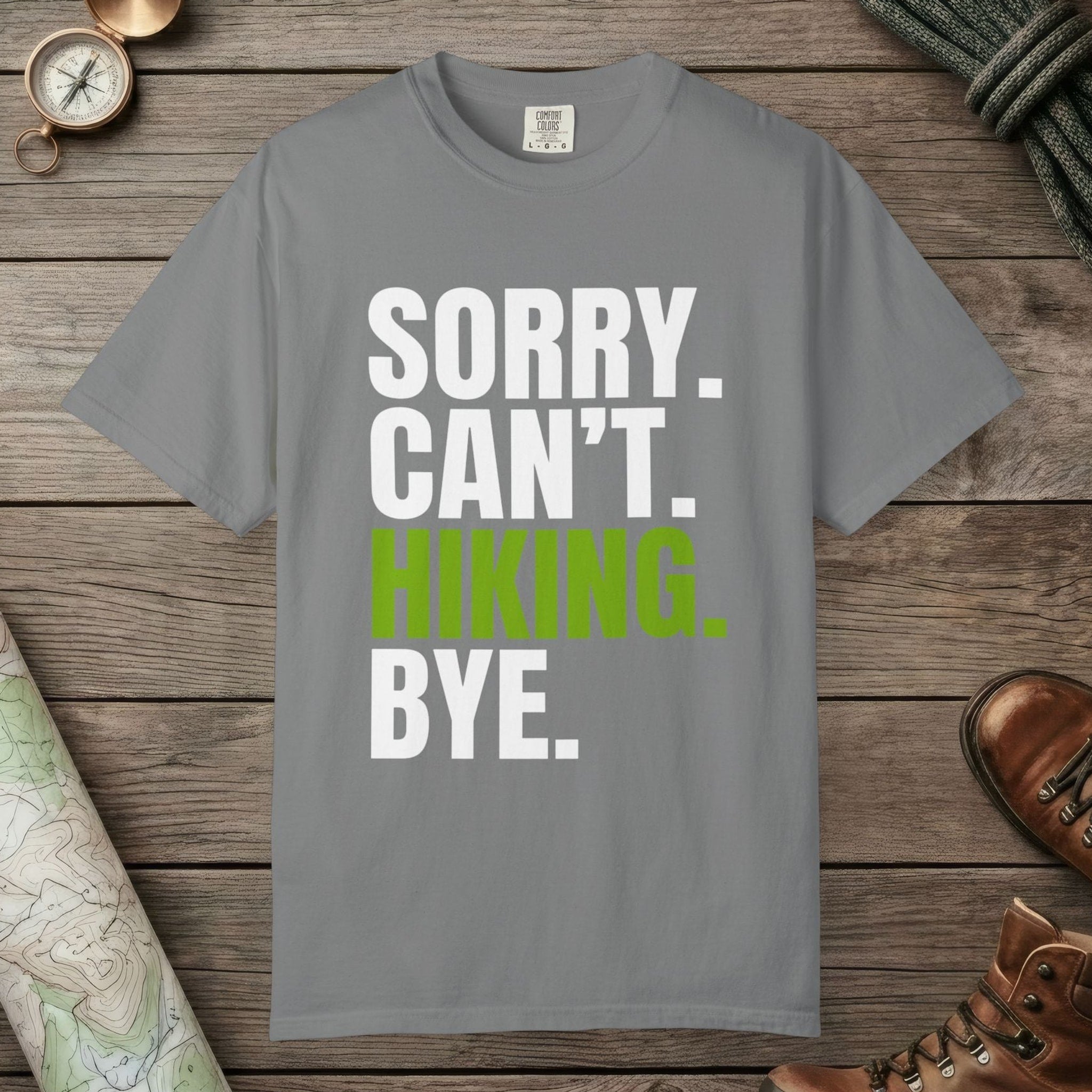 Grey color unisex graphic t-shirt with "Sorry. Can't. Hiking." design