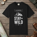 Black color unisex graphic t-shirt with "Stay Wild" design