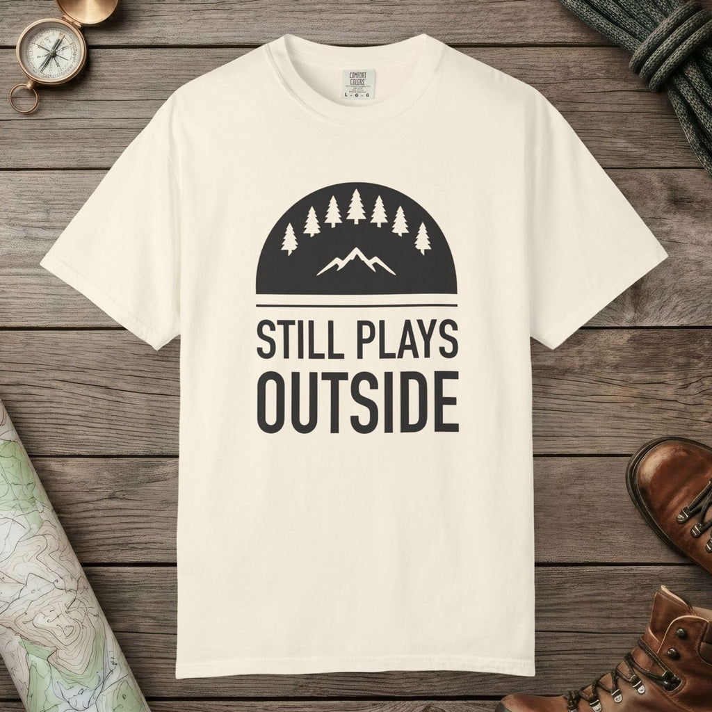 Ivory color unisex graphic t-shirt with "Still Plays Outside" design