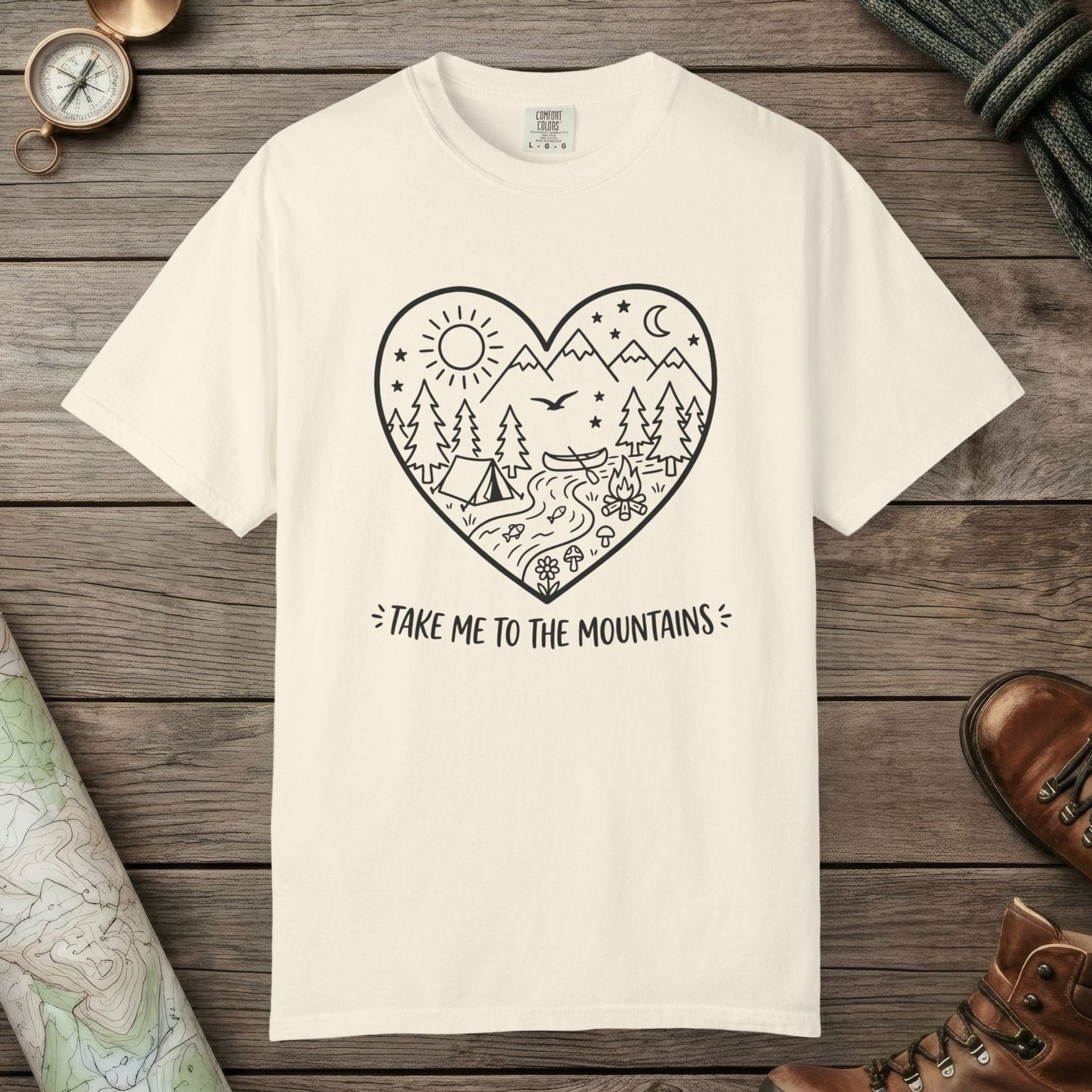 Ivory color unisex graphic t-shirt with "Take Me To The Mountains" design