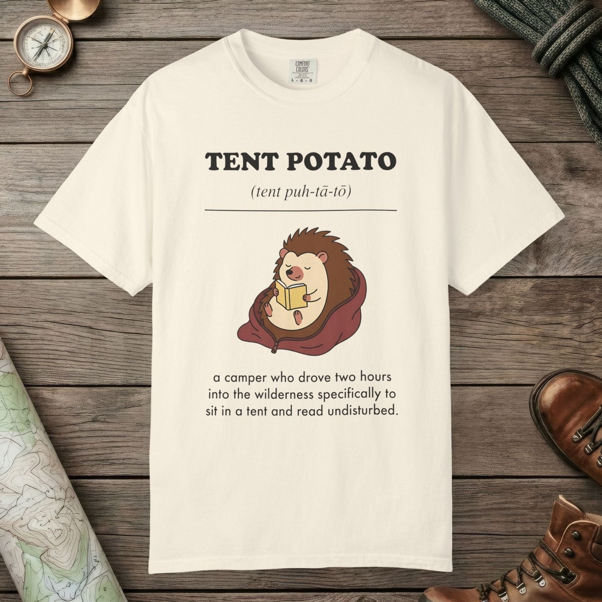 Ivory color unisex graphic t-shirt with "Tent Potato Definition" design