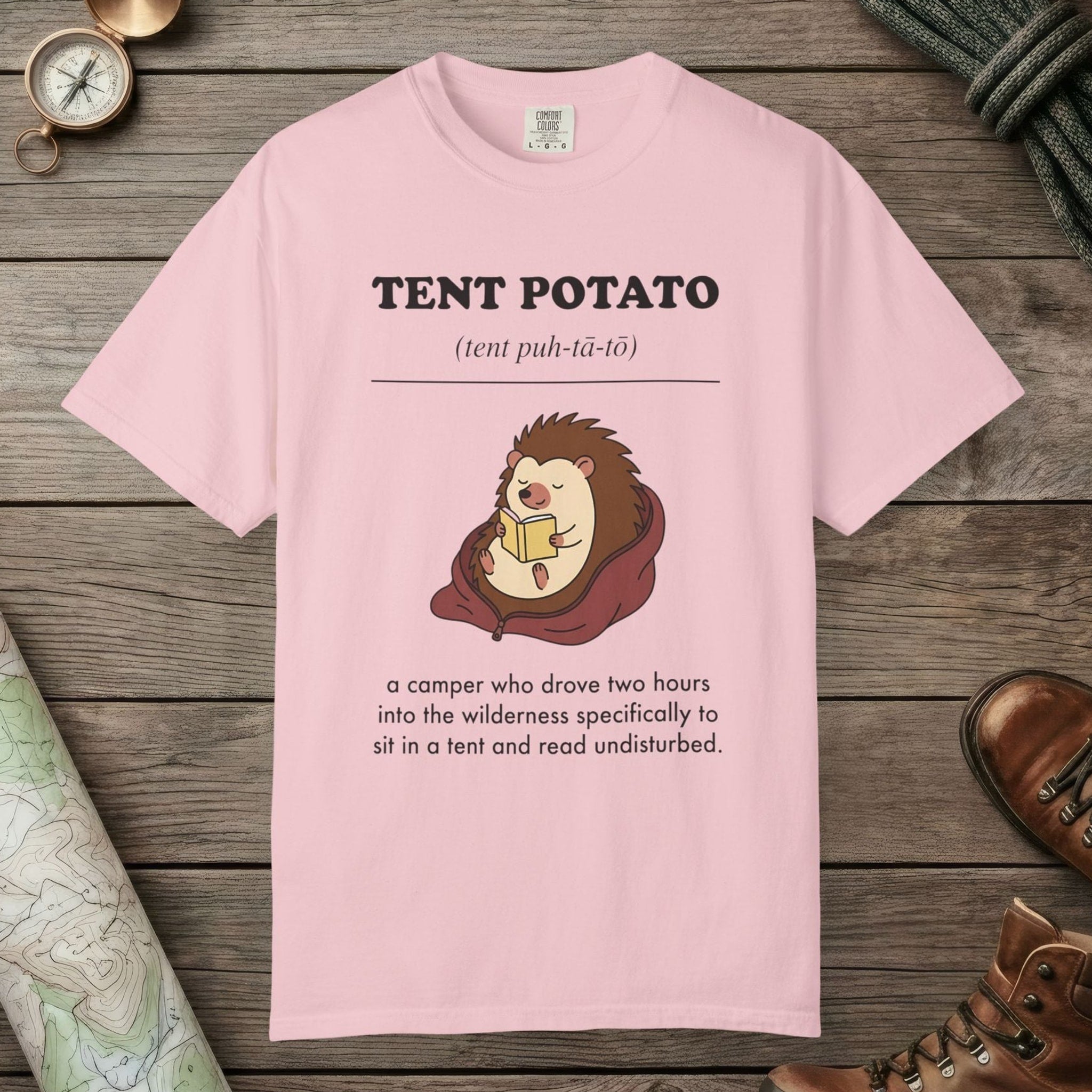 Blossom color unisex graphic t-shirt with "Tent Potato Definition" design